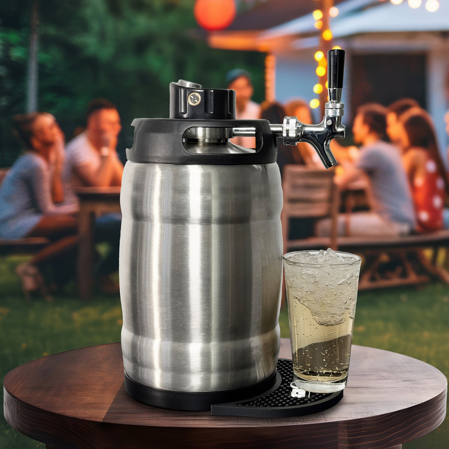 7L Gloria Rose brushed stainless steel with fixed tap and and iced beverage on a wooden table outdoors with people in blurred background